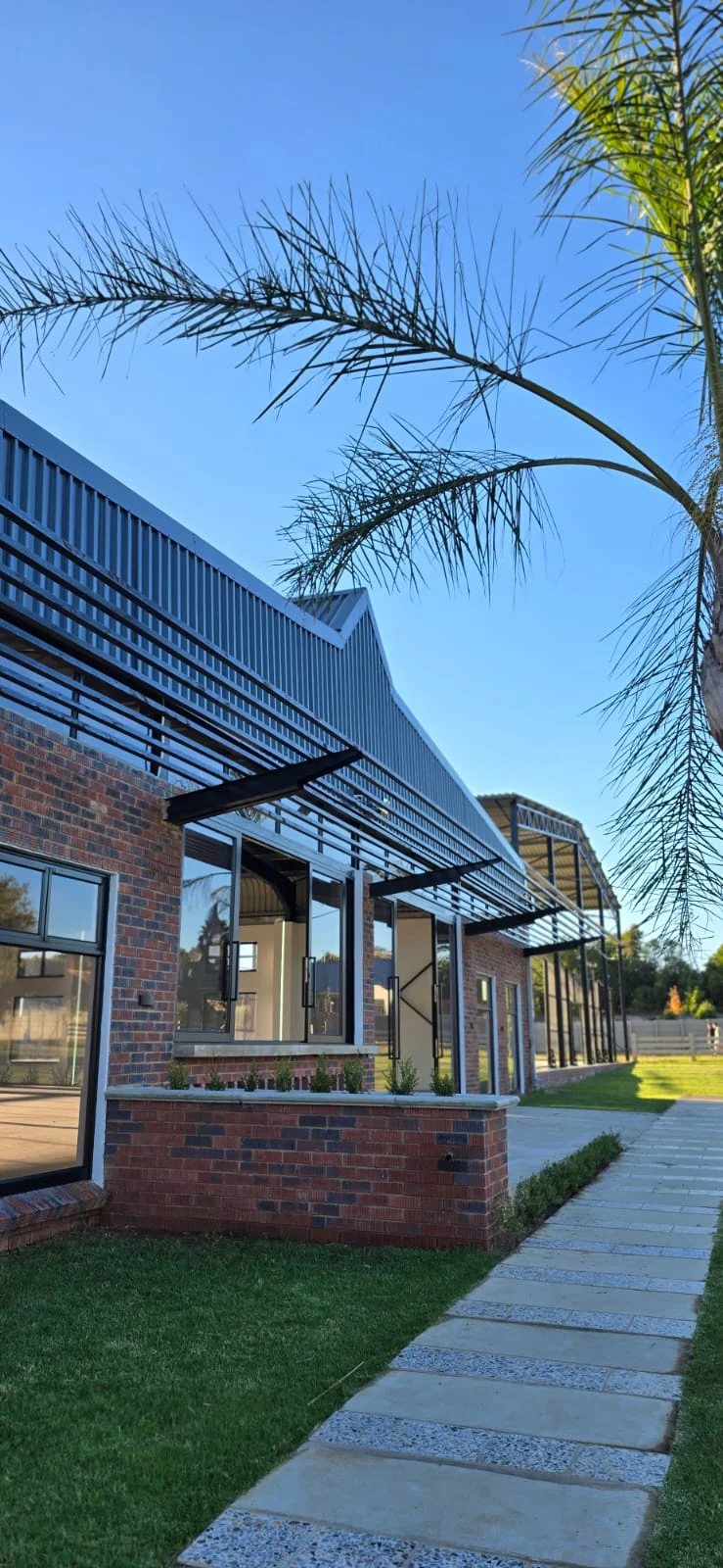 Brick and glass exterior of the venue